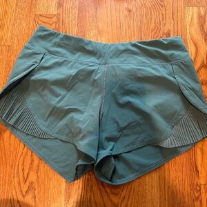Blue lululemon shorts with pleats on side
